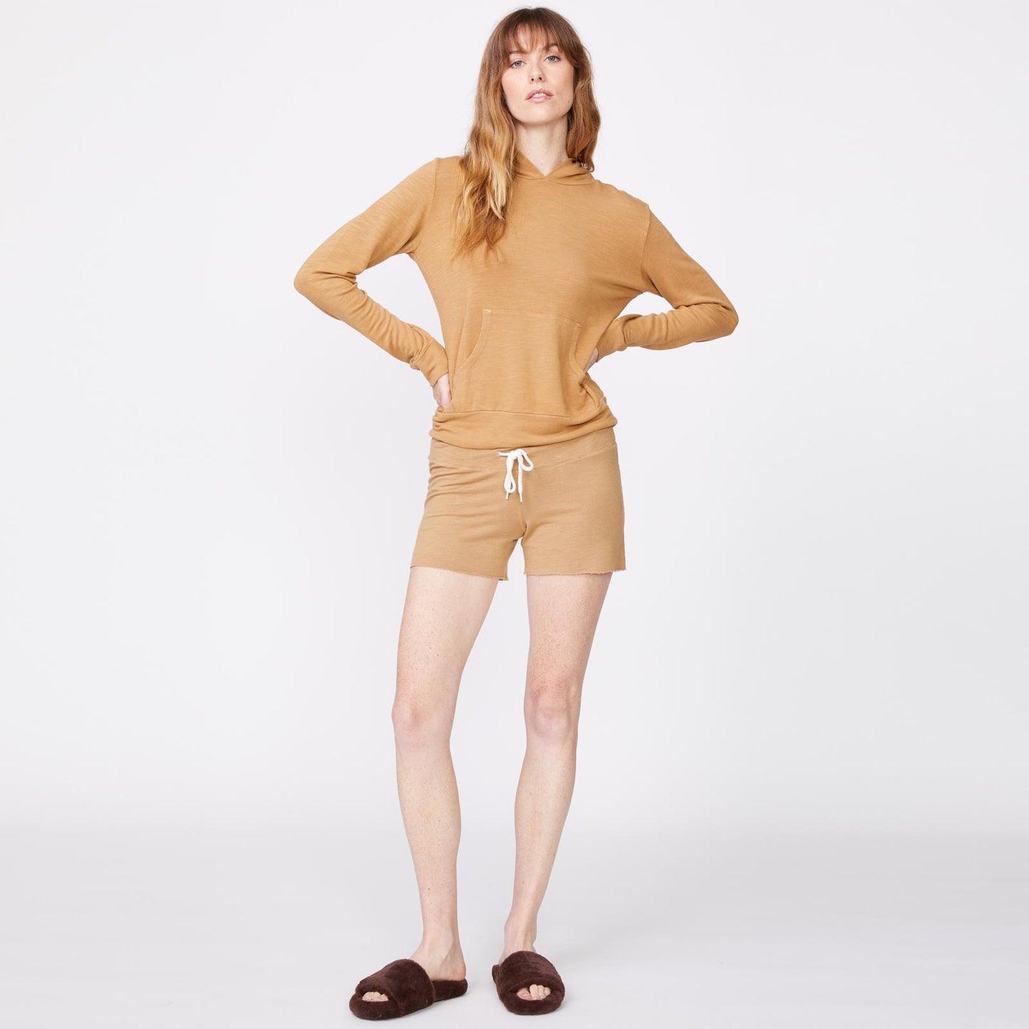 Front view of model wearing the supersoft vintage shorts in latte.