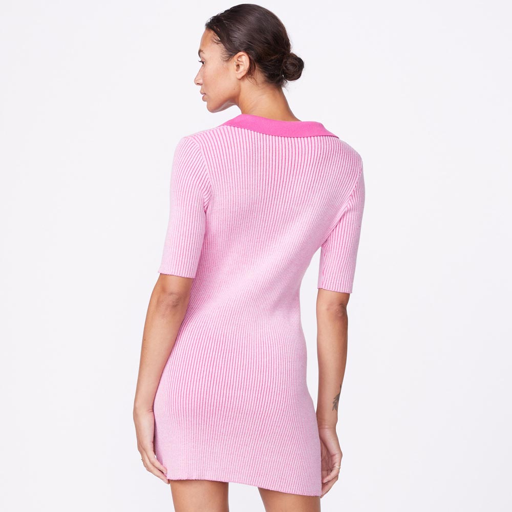 Back view of model wearing the polo sweater dress in bubble gum.