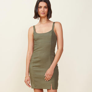 Front view of model wearing the linen cami dress in army.