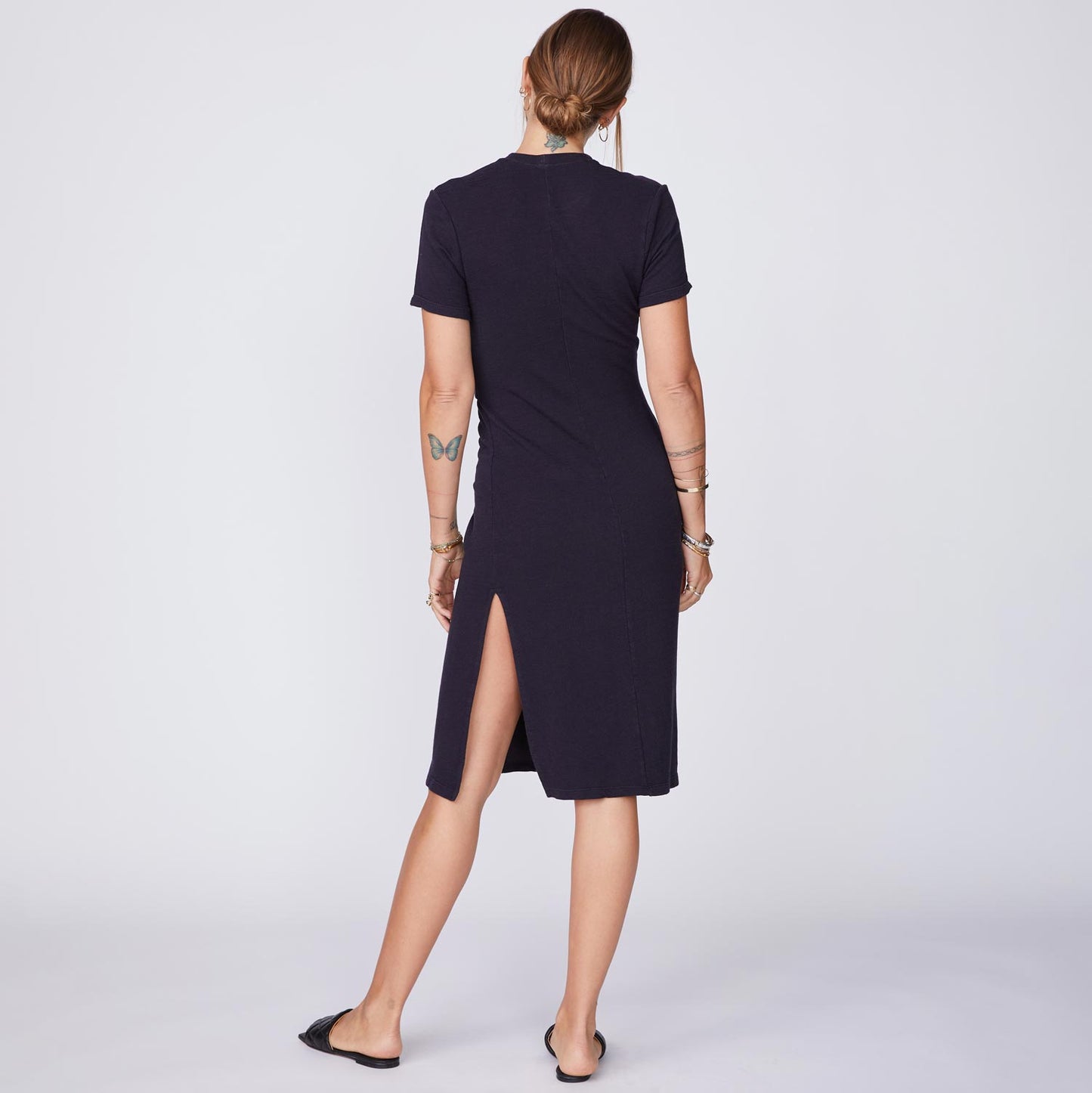 Back View of model wearing the Supersoft Front Twist Dress in Faded Black