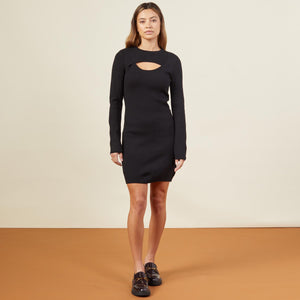 Front view of model wearing the supersoft sweater knit cut out dress in black.