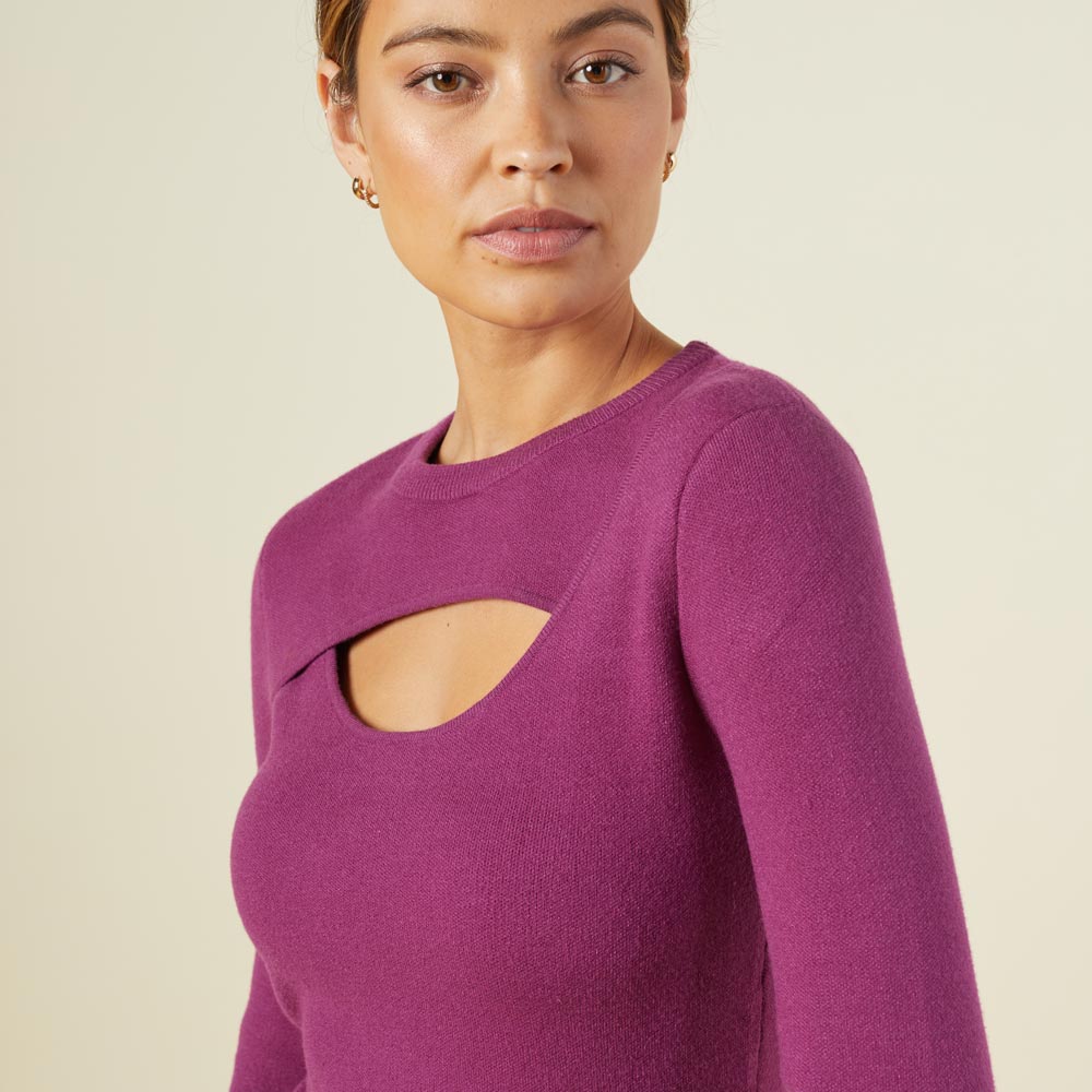 Close up view of model wearing the supersoft sweater knit cut out dress in raspberry rose.