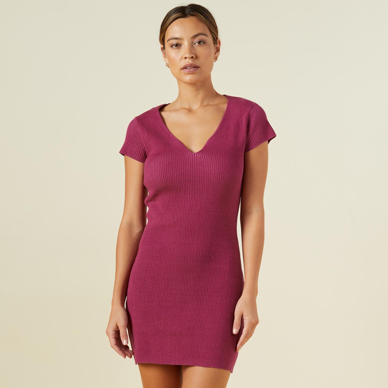 Front view of model wearing the sweater rib mini dress in raspberry rose.