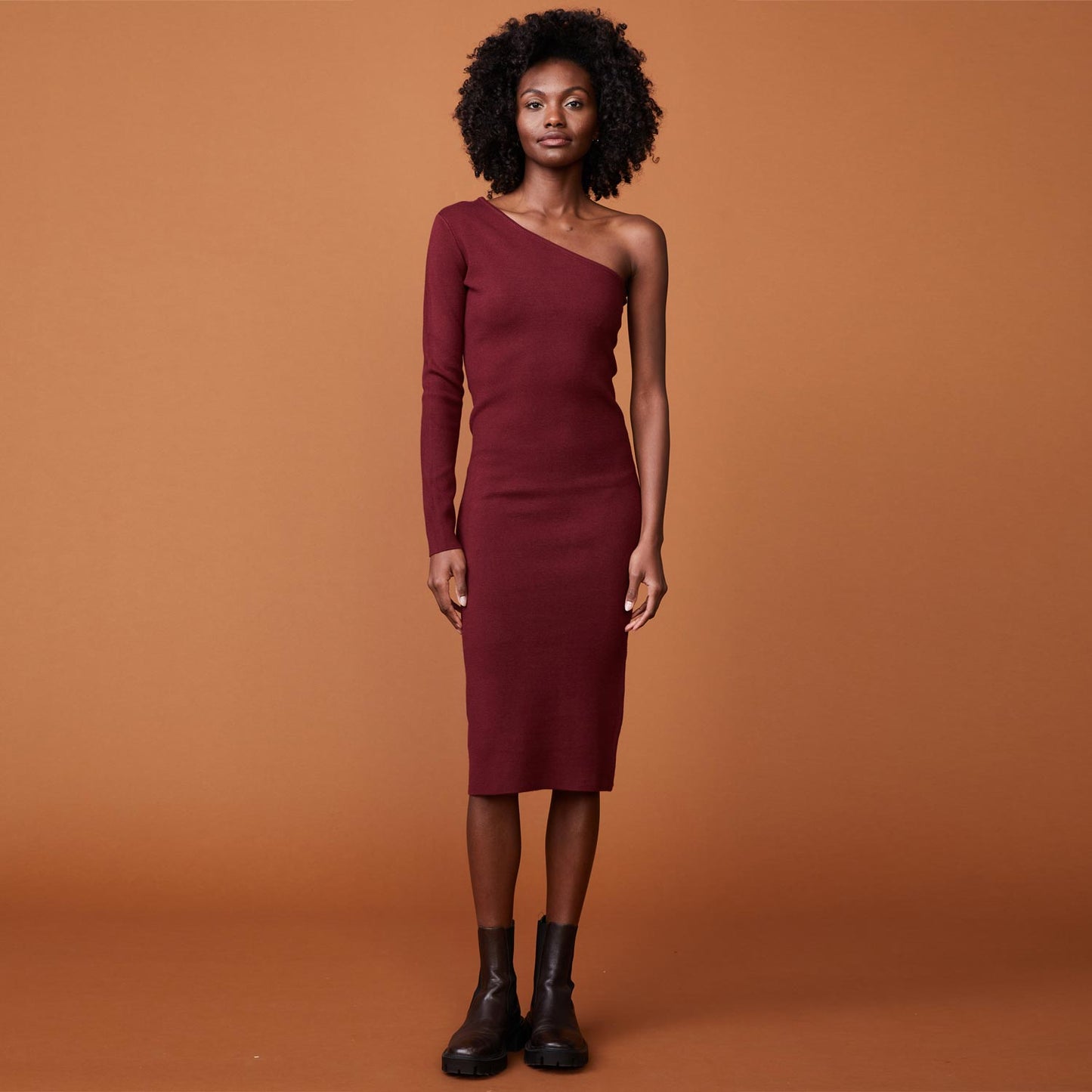 Front view of model wearing the supersoft sweater knit one shoulder dress in rhubarb.