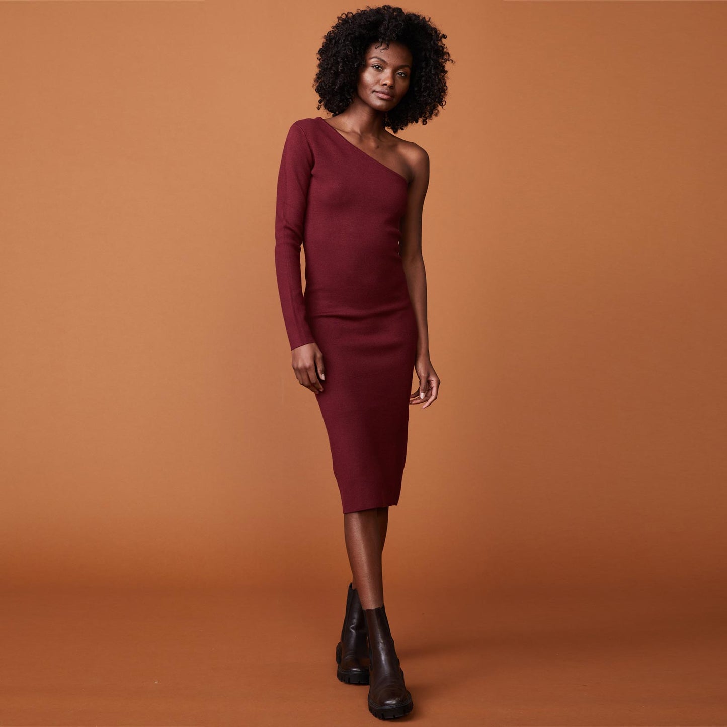 Front view of model wearing the supersoft sweater knit one shoulder dress in rhubarb.