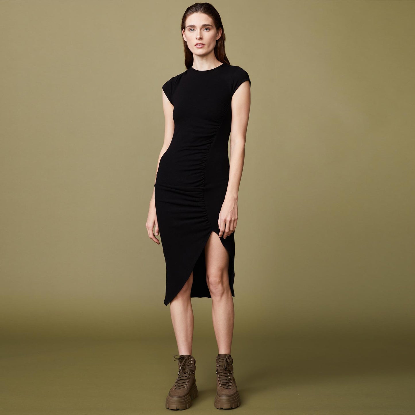 Front view of model wearing the supersoft cap sleeve shirred dress in black.