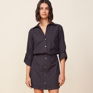 Front view of model wearing the poplin shirt dress in faded black.
