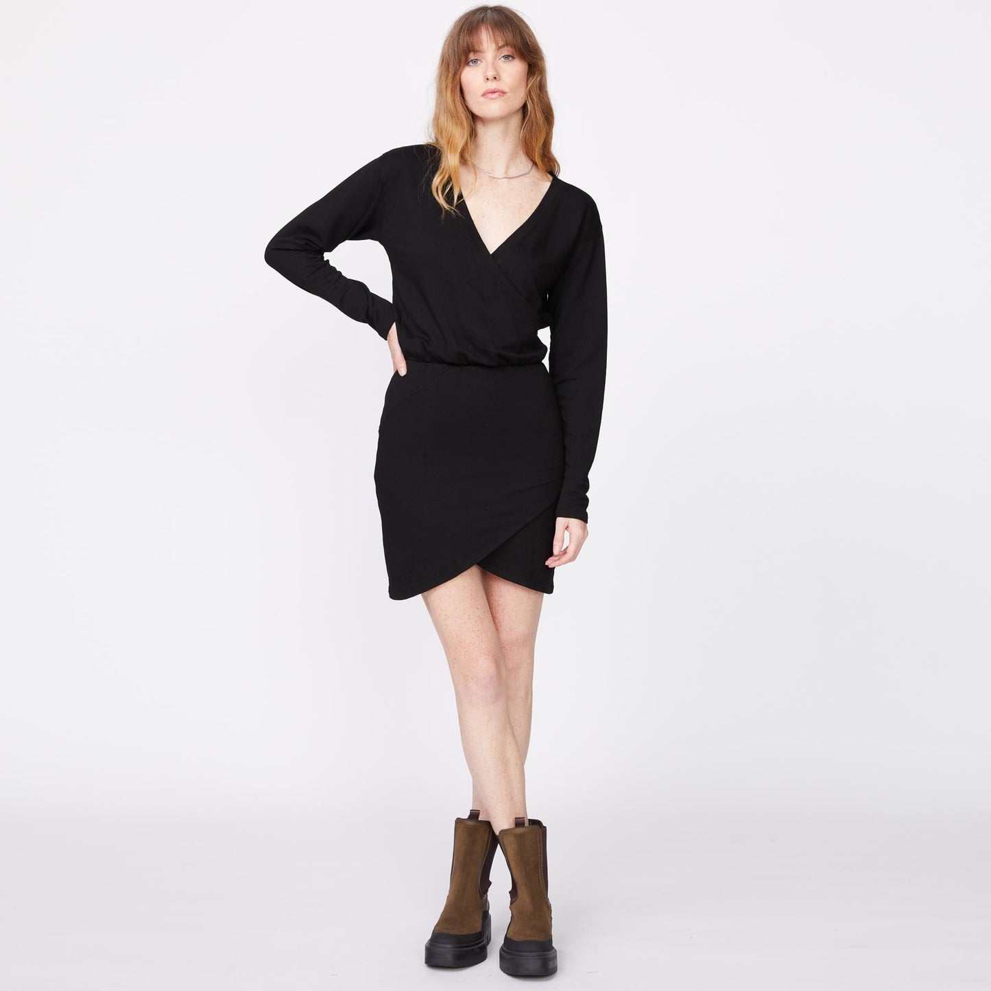 Front view of model wearing the supersoft fleece crossover v dress in black.