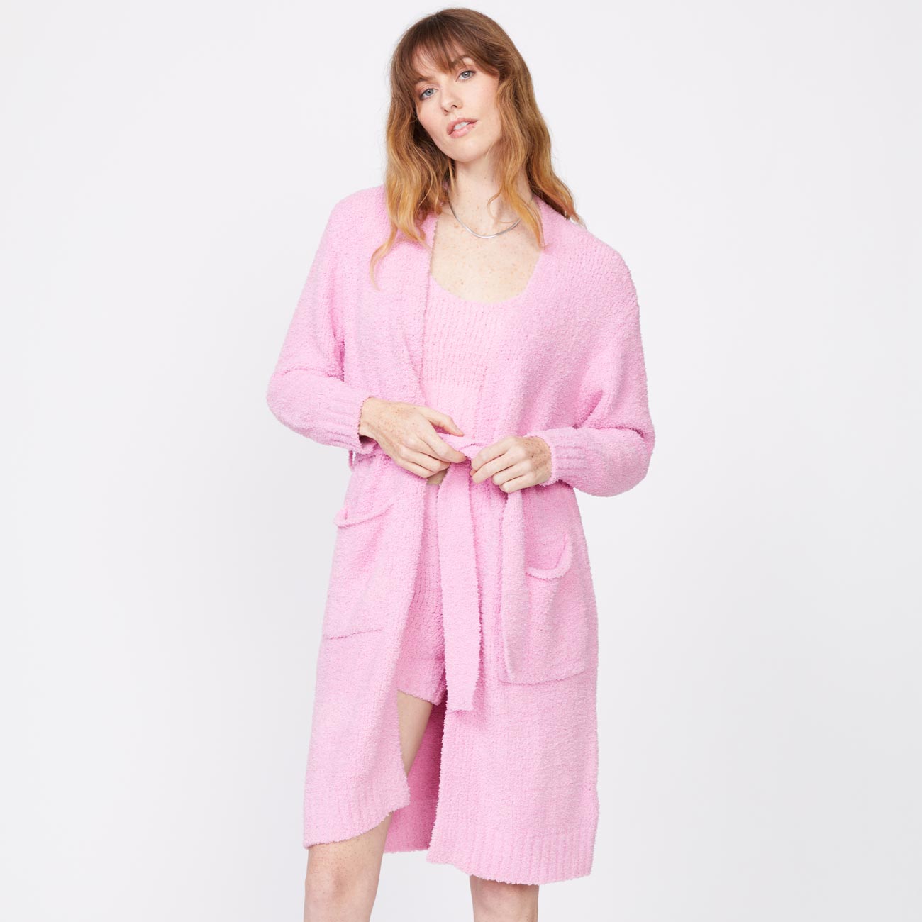 Front view of model wearing the plush sweater robe in orchid.