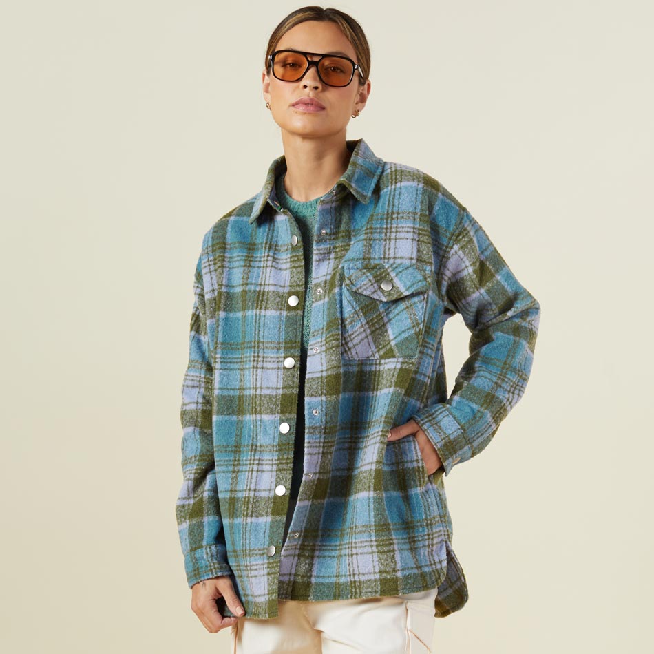 Front view of model wearing the plaid shacket in lilac/green/blue.