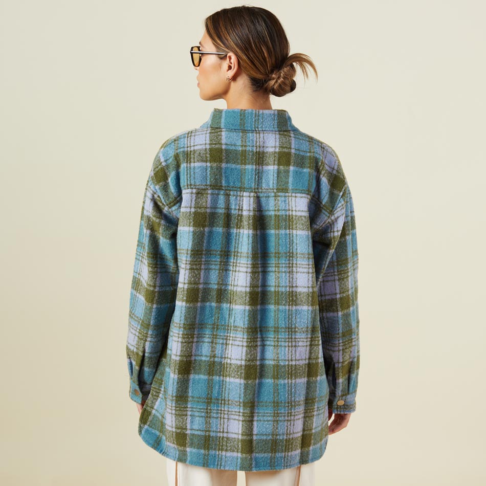 Back view of model wearing the plaid shacket in lilac/green/blue.