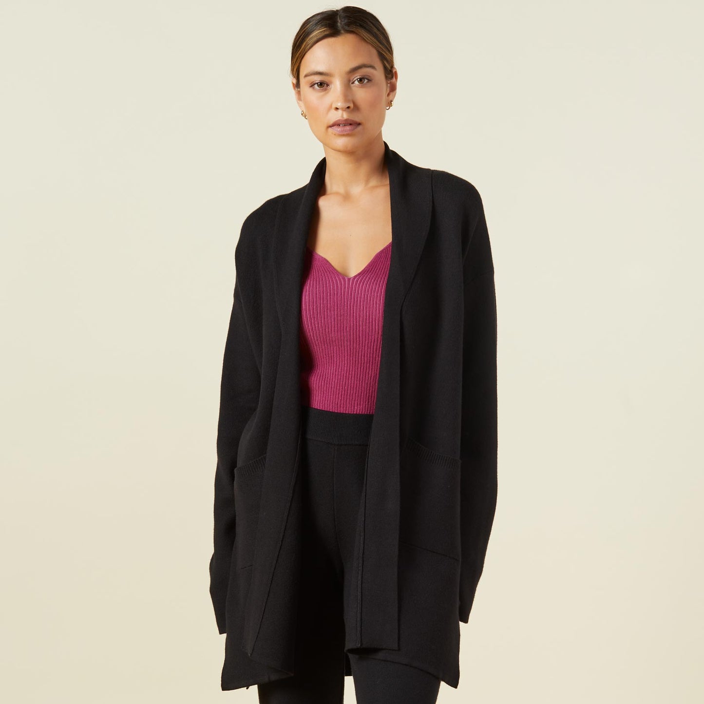 Front view of model wearing the supersoft sweater knit cardigan in black.