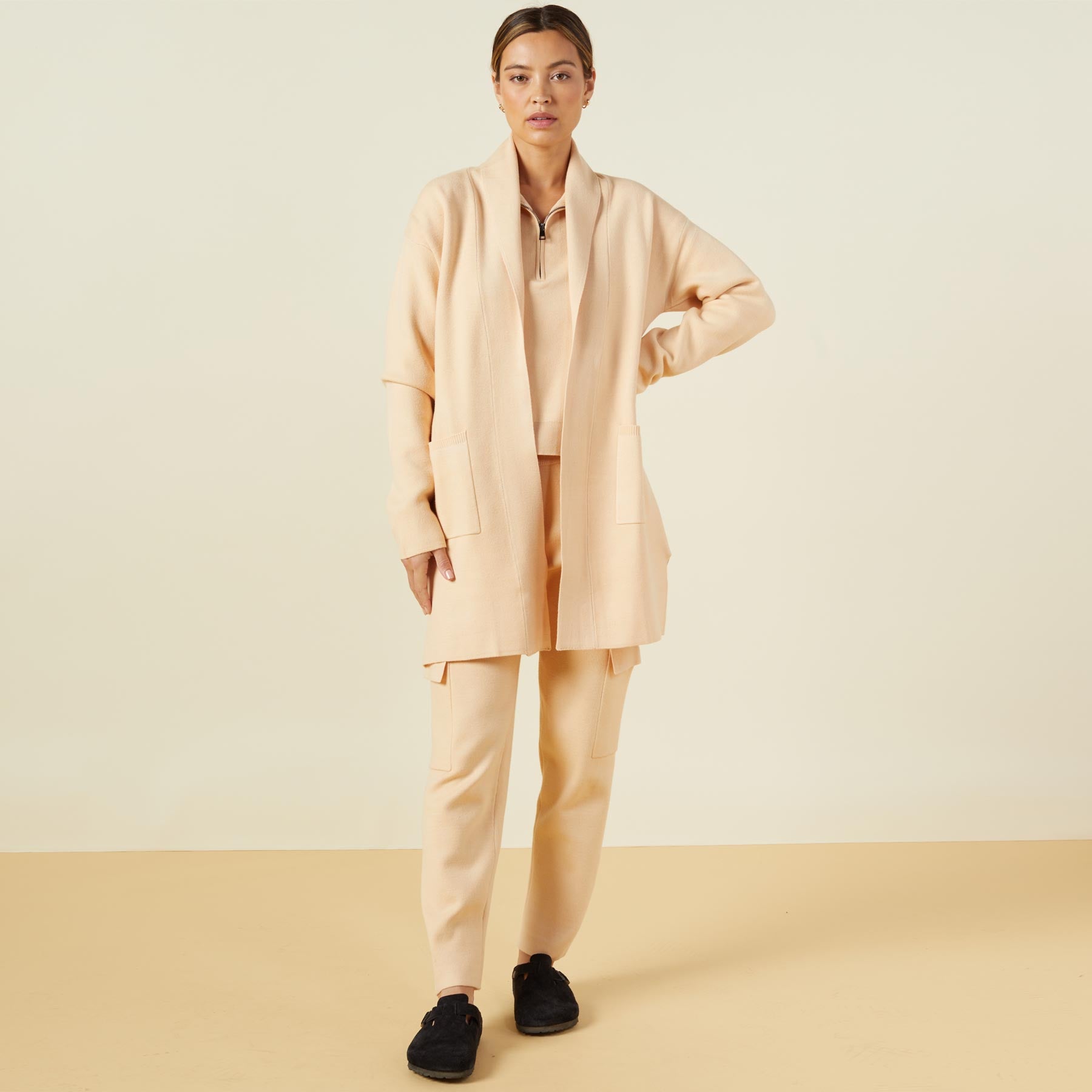 Front view of model wearing the supersoft sweater knit cardigan in vanilla.