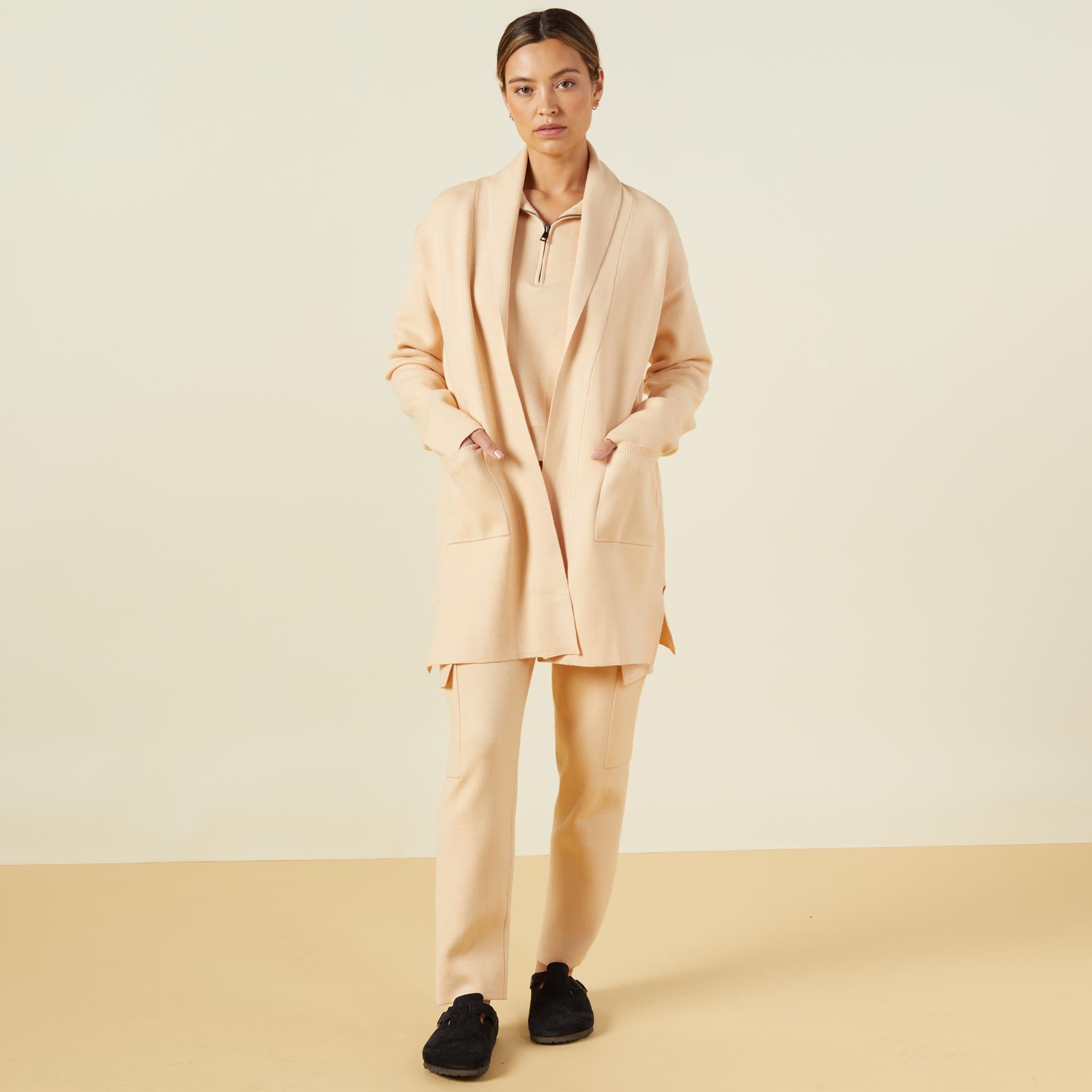 Front view of model wearing the supersoft sweater knit cardigan in vanilla.