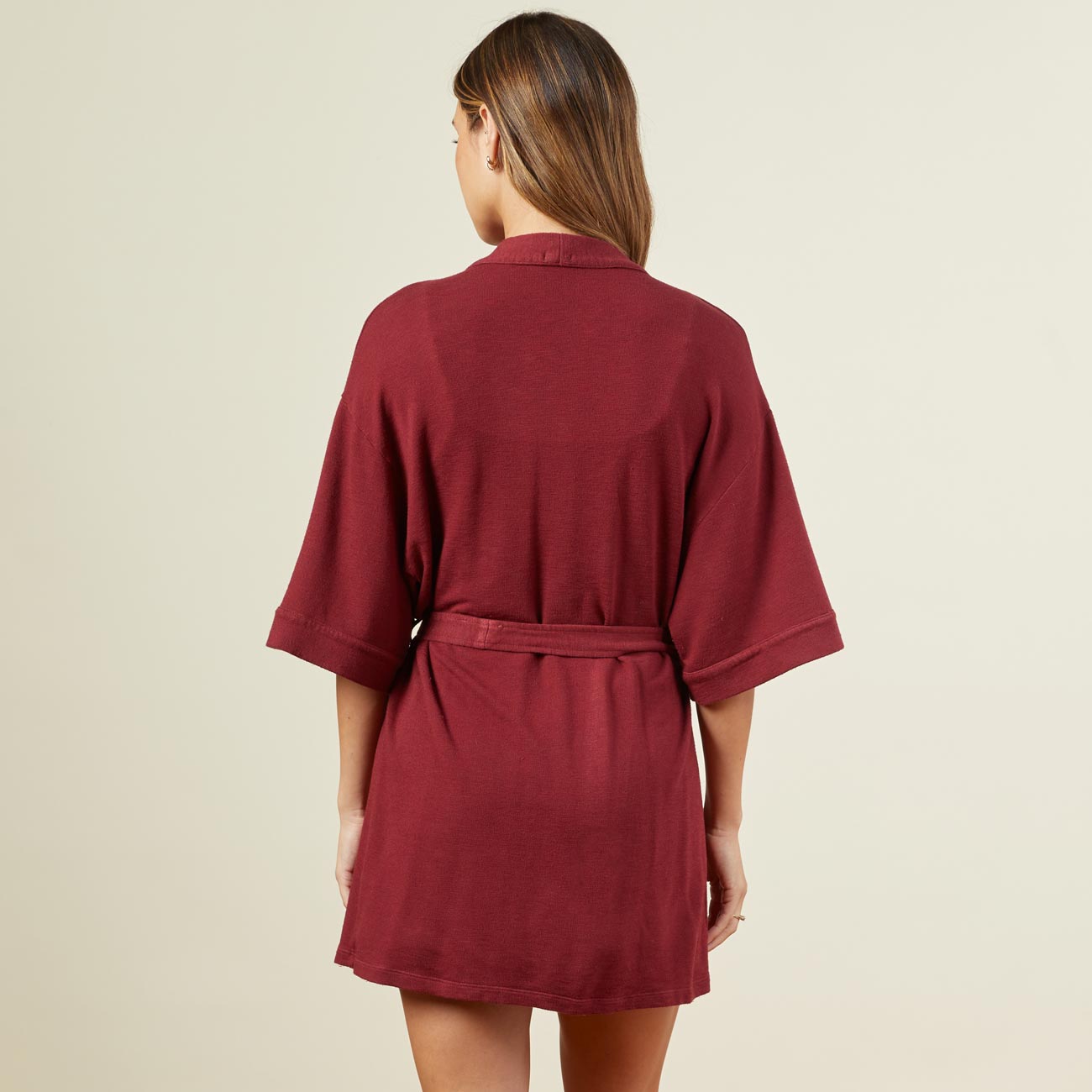 Back view of model wearing the supersoft robe in rhubarb.