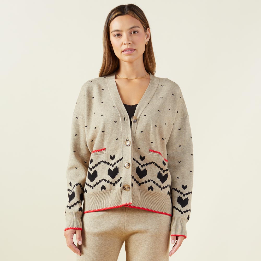 Front view of model wearing the supersoft sweater knit heart fair isle cardigan in oatmeal.