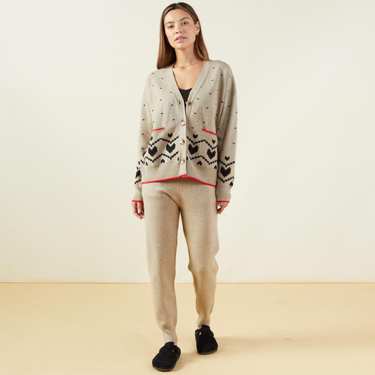 Front view of model wearing the supersoft sweater knit heart fair isle cardigan in oatmeal.