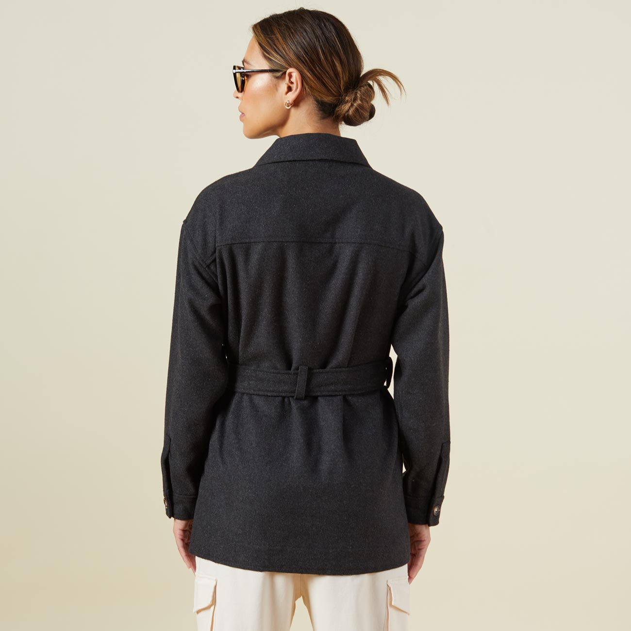 Back view of model wearing the safari jacket in charcoal.