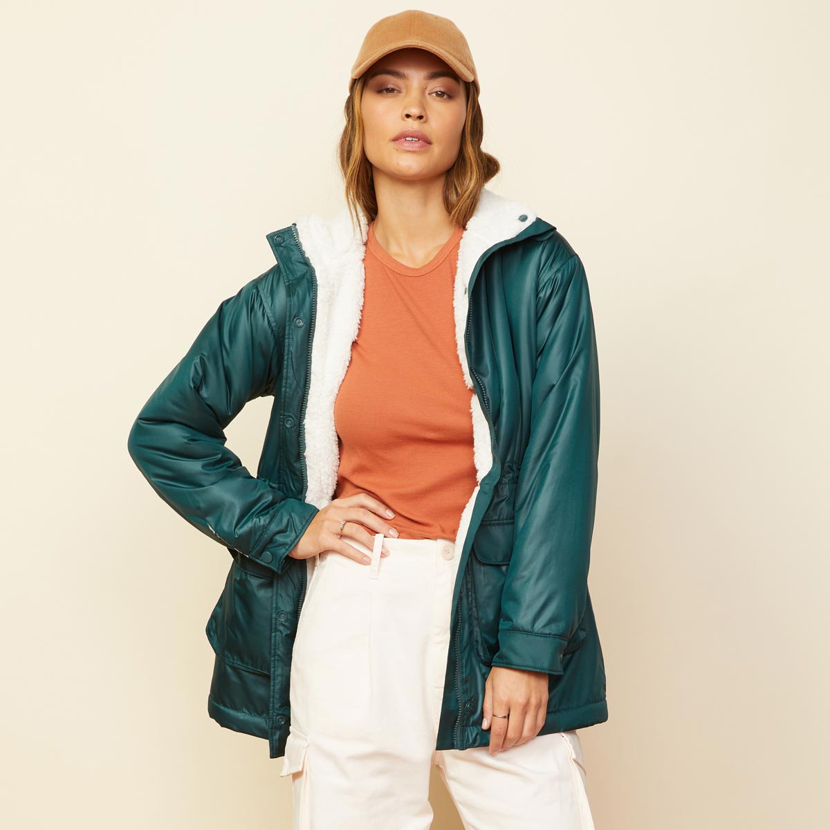 Front view of model wearing the reversible sherpa lined jacket in deep forest.