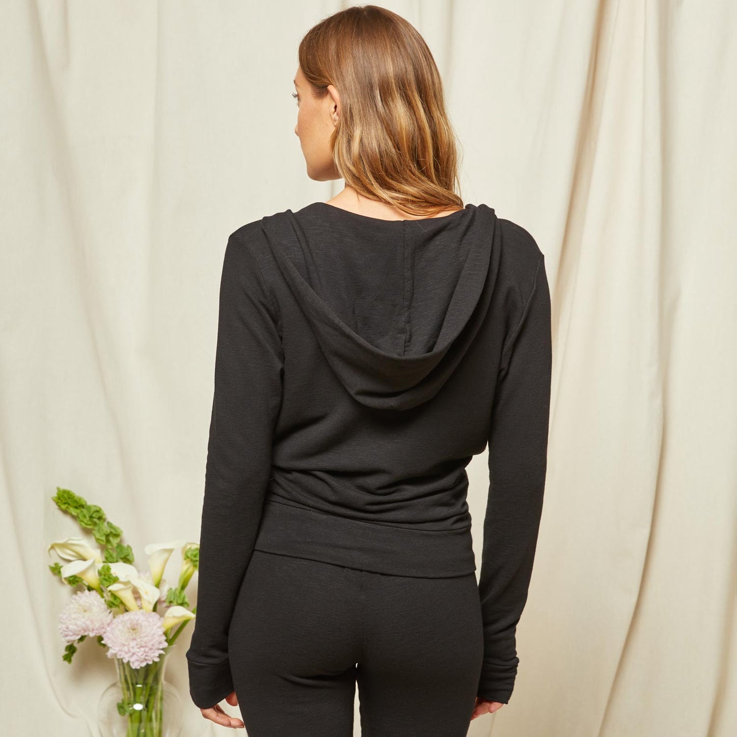 Back view of model wearing the Bridal Supersoft Zip Up Hoody in Black.