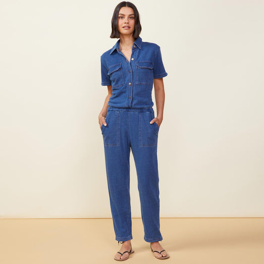 Front view of model wearing the indigo french terry jumpsuit in indigo.