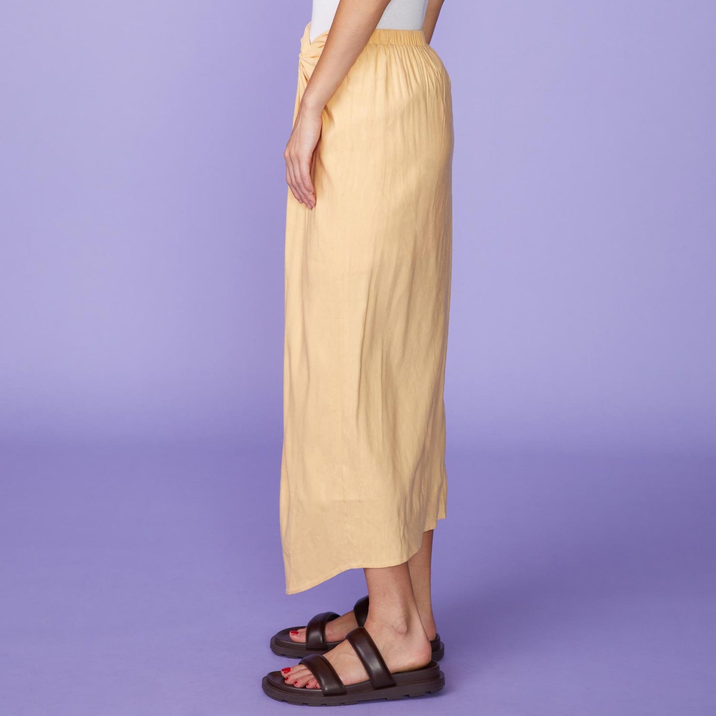 Side View of model wearing the Linen Sarong Skirt in Sand