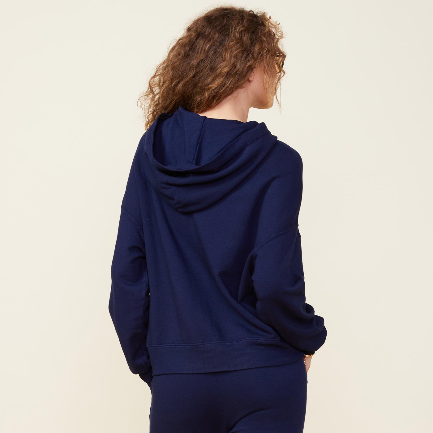 Back view of model wearing the supersoft fleece slouchy pullover in navy.
