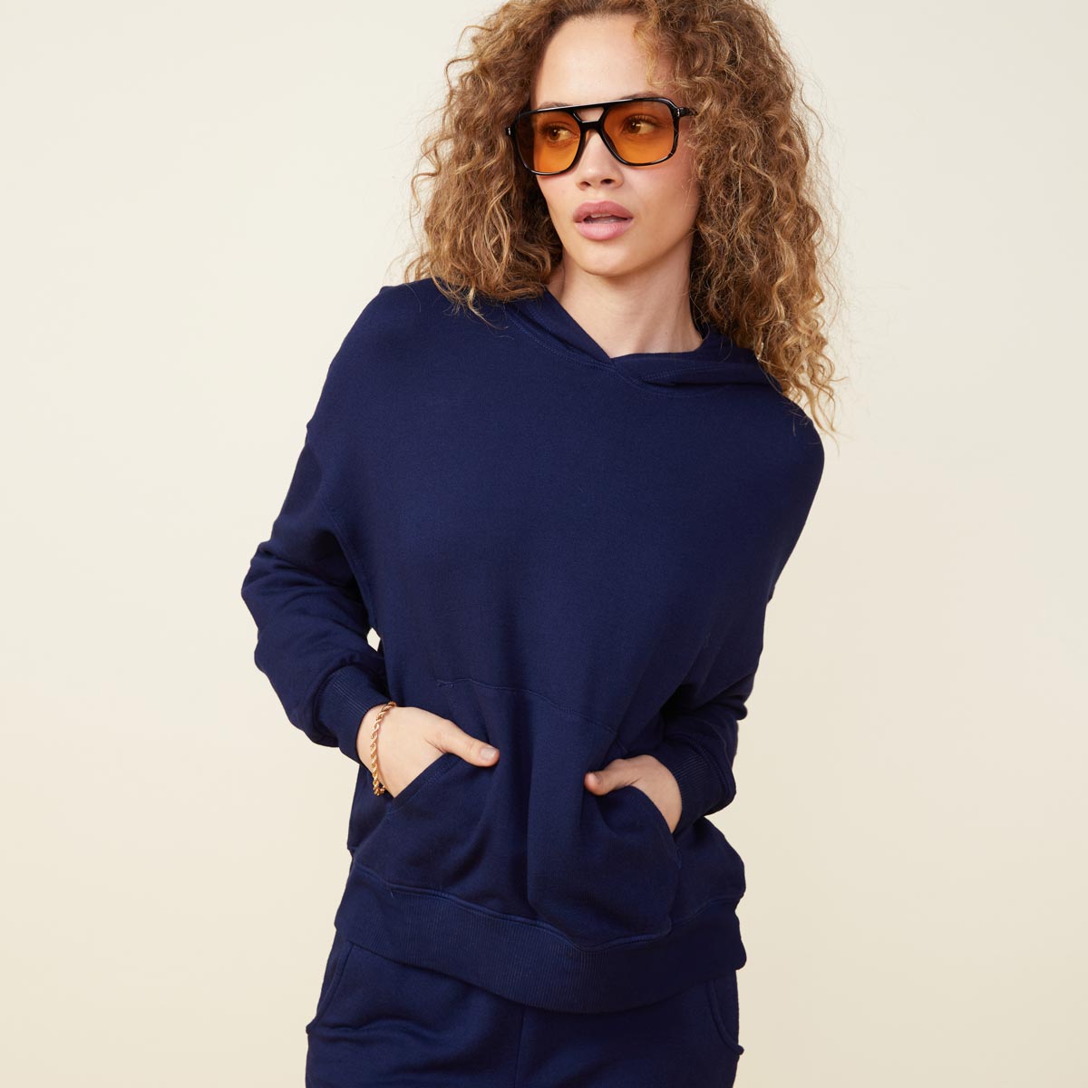 Front view of model wearing the supersoft fleece slouchy pullover in navy.