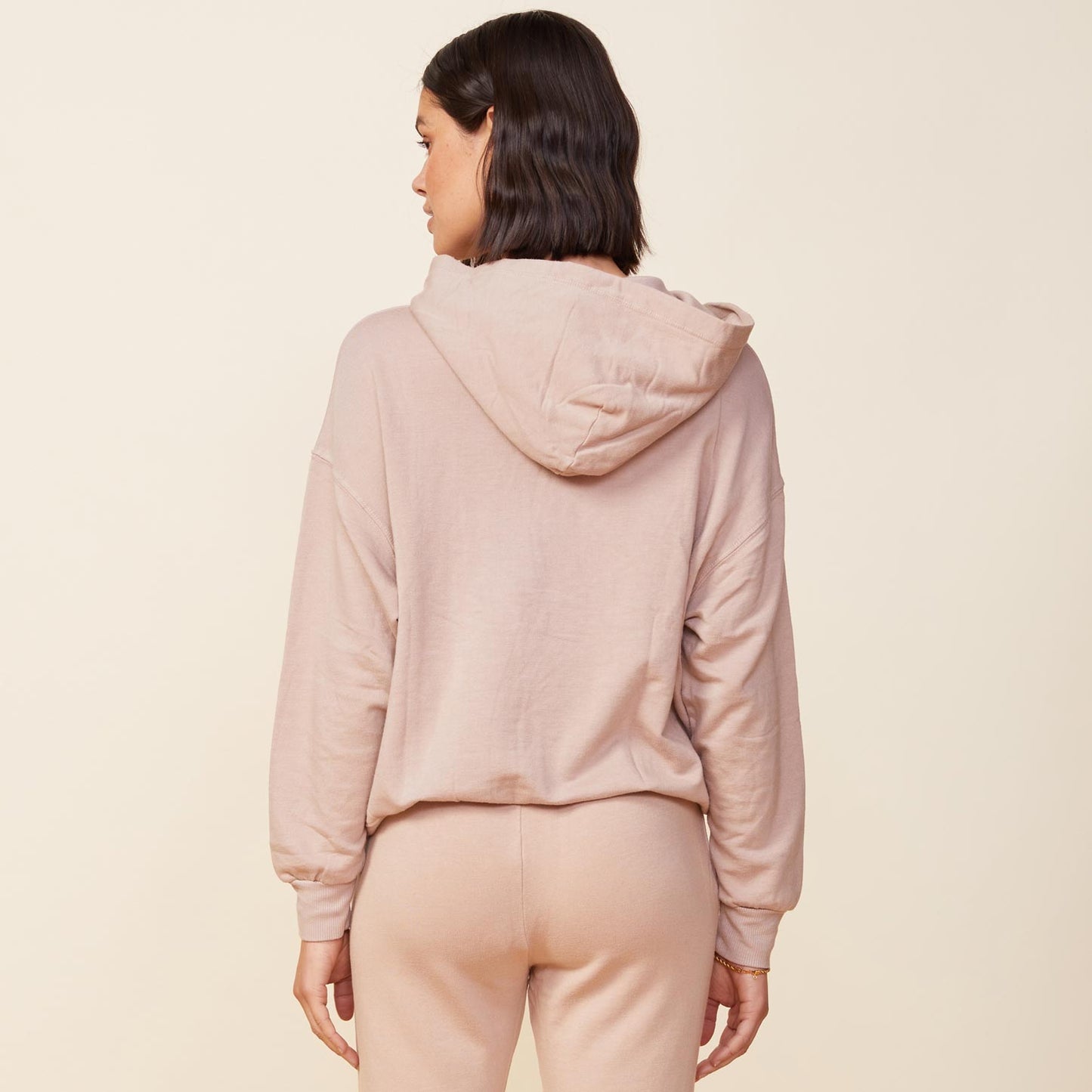 Back view of model wearing the supersoft fleece slouchy pullover in taupe.