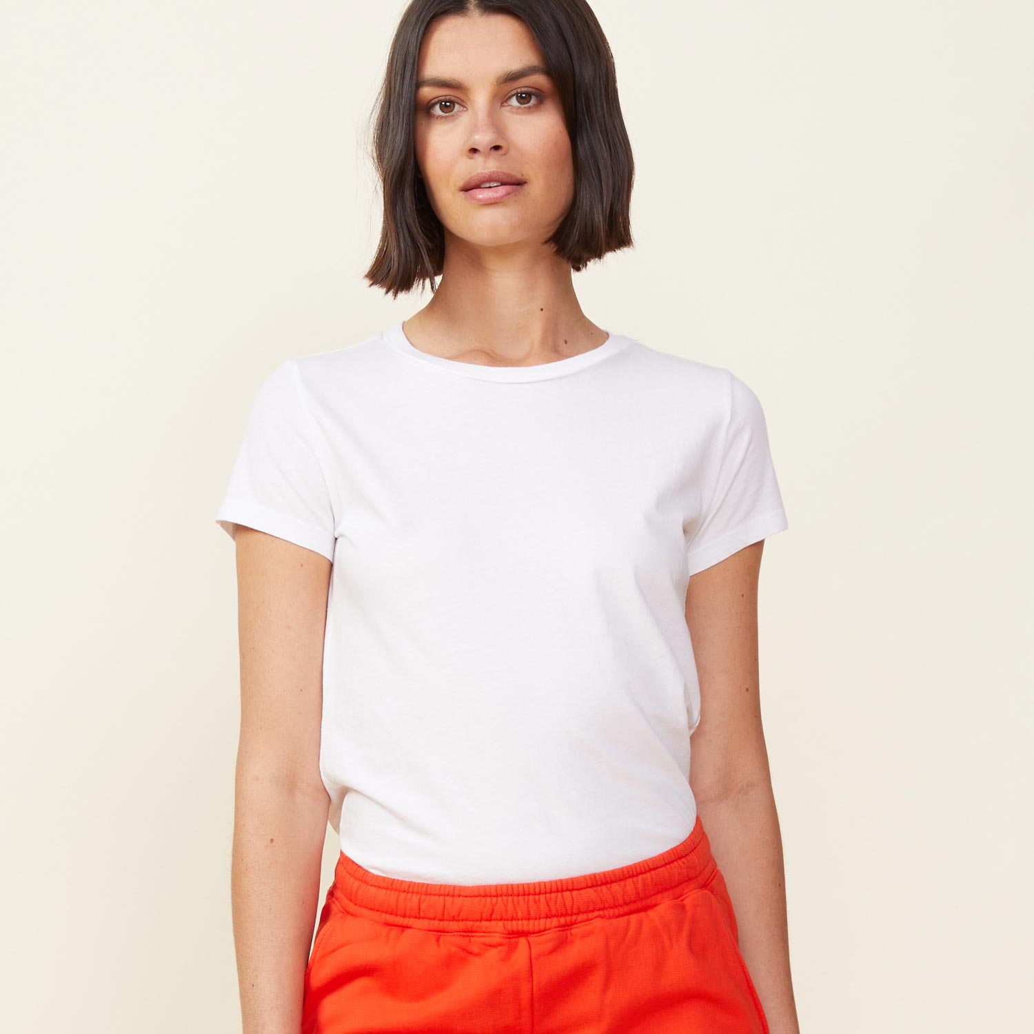 Front view of model wearing the 90's tee in white.