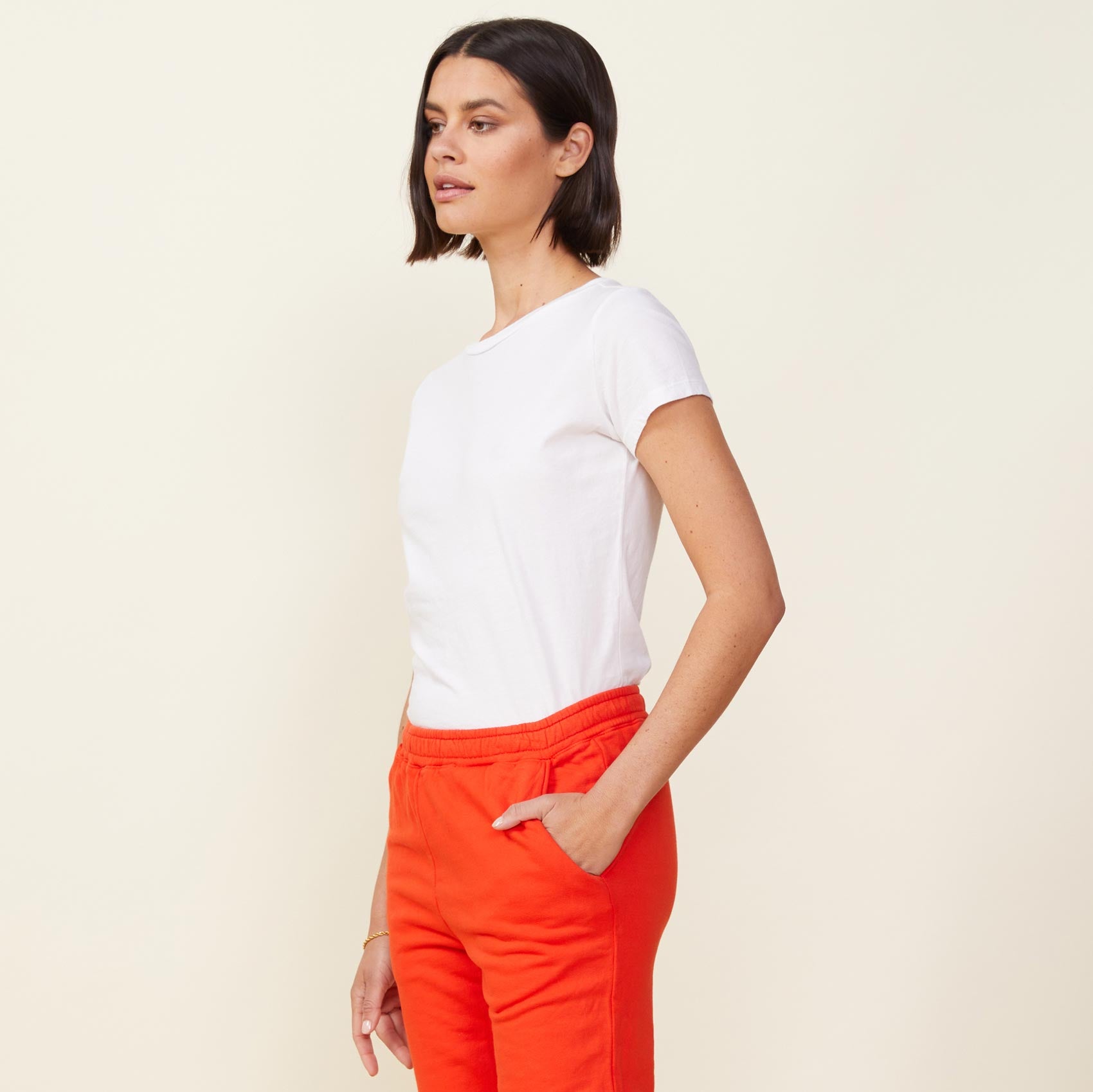 Side view of model wearing the 90's tee in white.