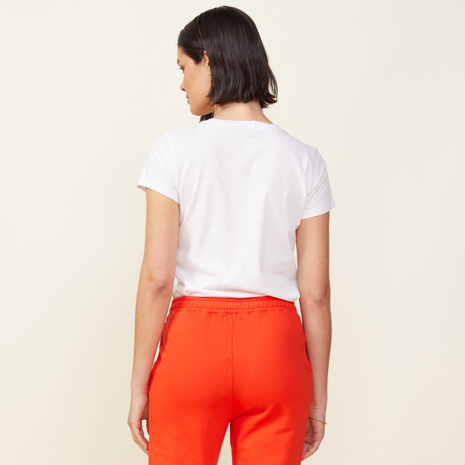 Back view of model wearing the 90's tee in white.