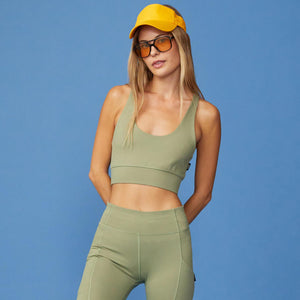 Front View of model wearing the Movement Sports Bra in Army