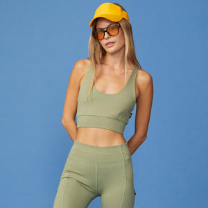 Front View of model wearing the Movement Sports Bra in Army