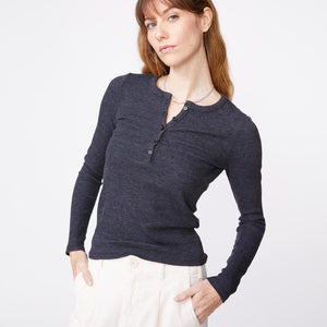 Front view of model wearing the thermal henley in black.