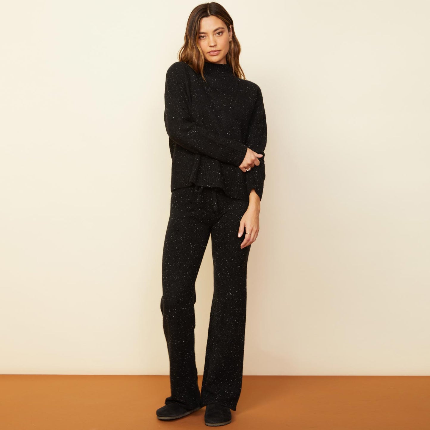 Front view of model wearing the cashmere neps lounge sweats in black.