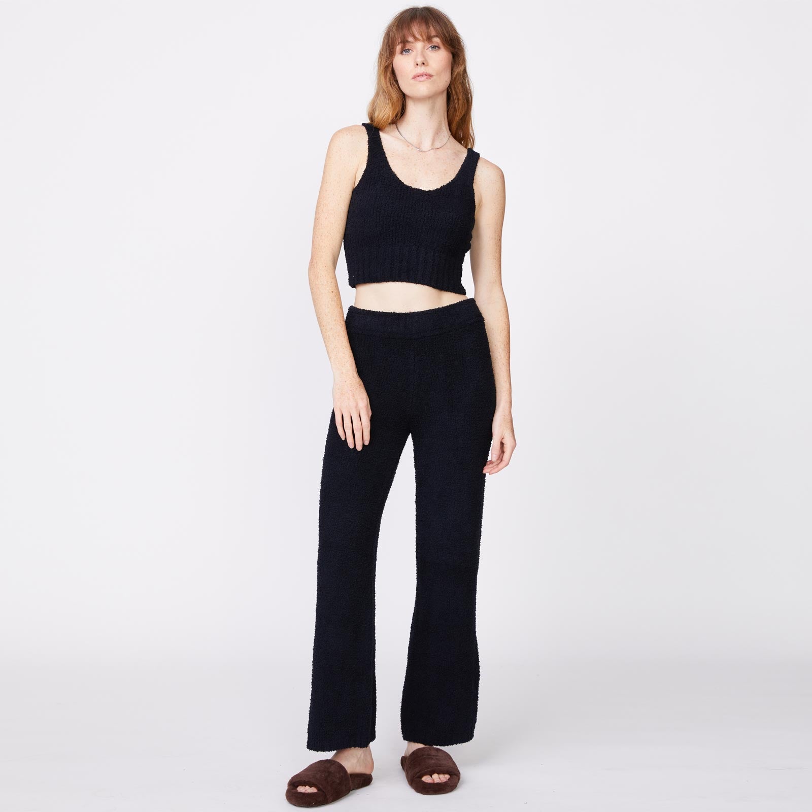 Front view of model wearing the plush sweater tank in black.