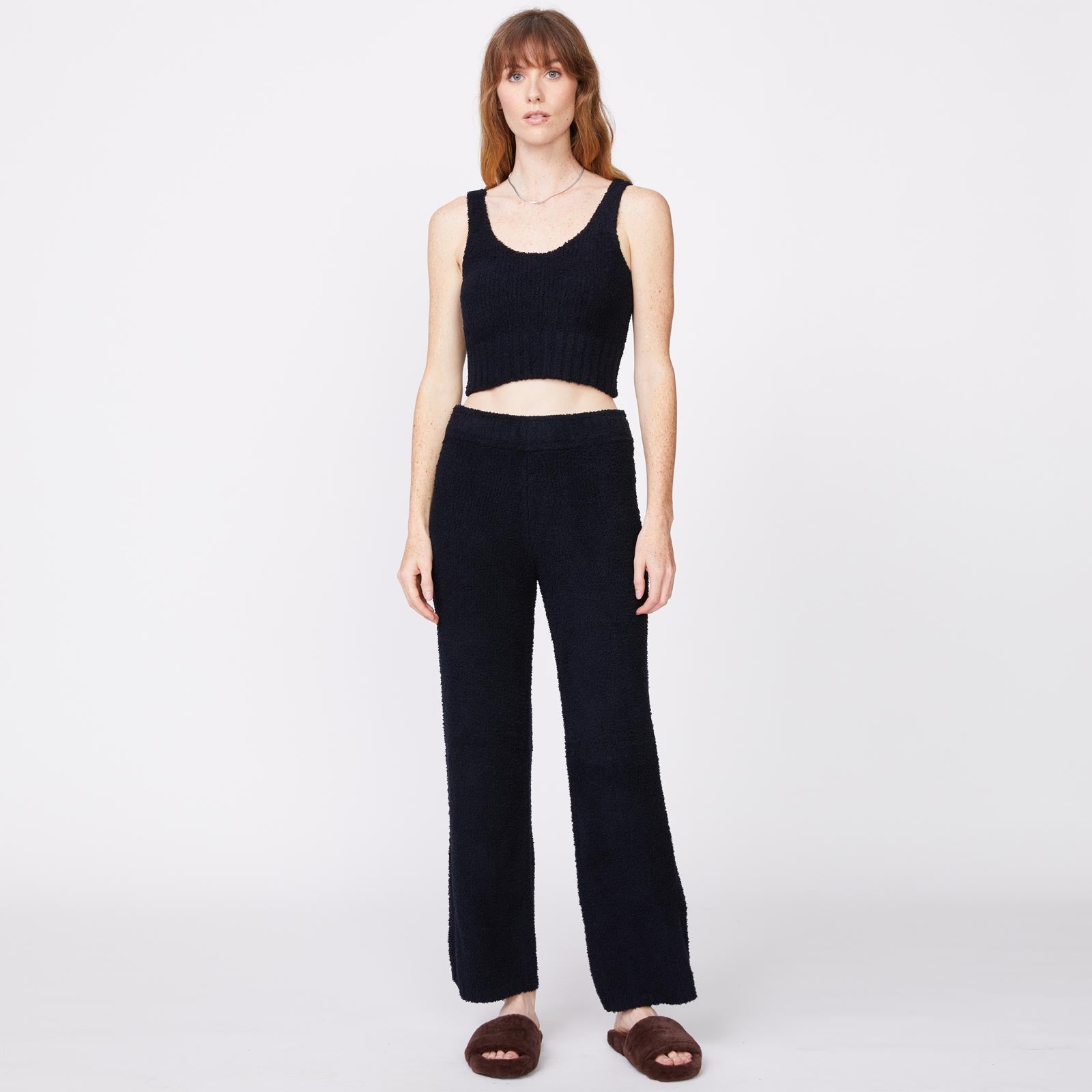 Front view of model wearing the plush sweater tank in black.