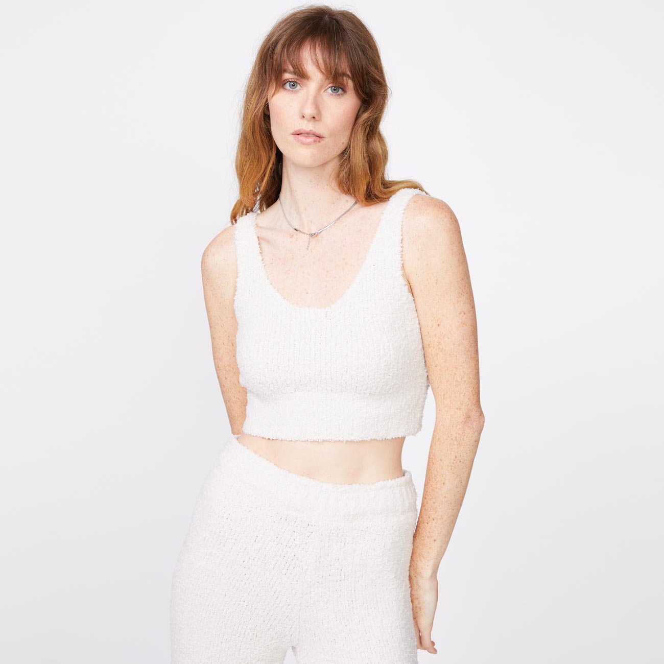 Front view of model wearing the plush sweater tank in chalk.
