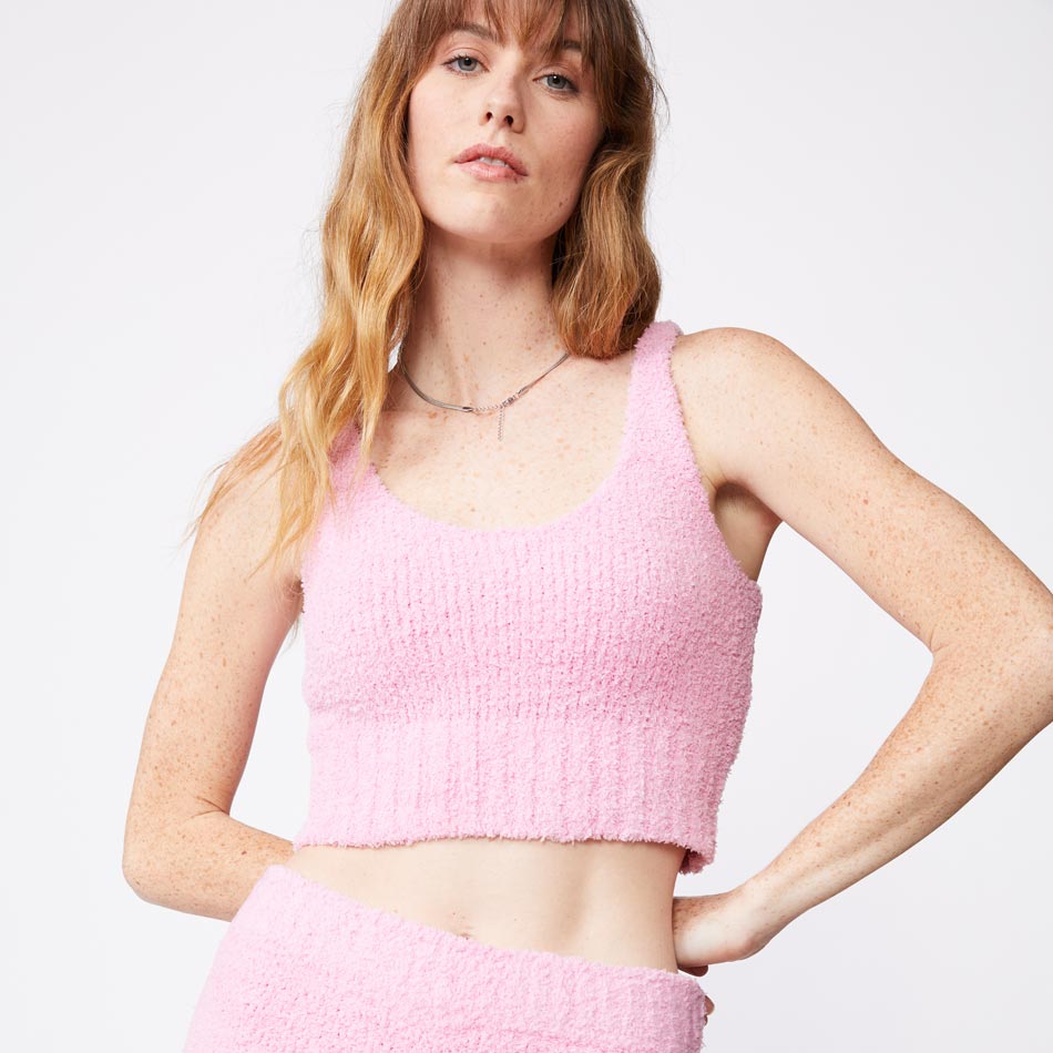 Front view of model wearing the plush sweater tank in orchid.