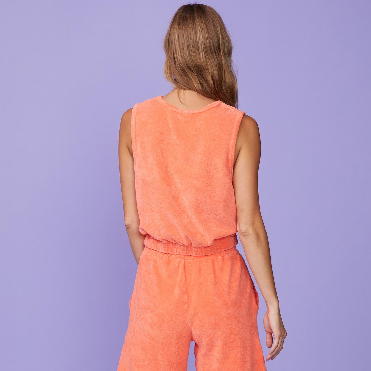 Back View of model wearing the Terry Cloth Tank in Georgia Peach.