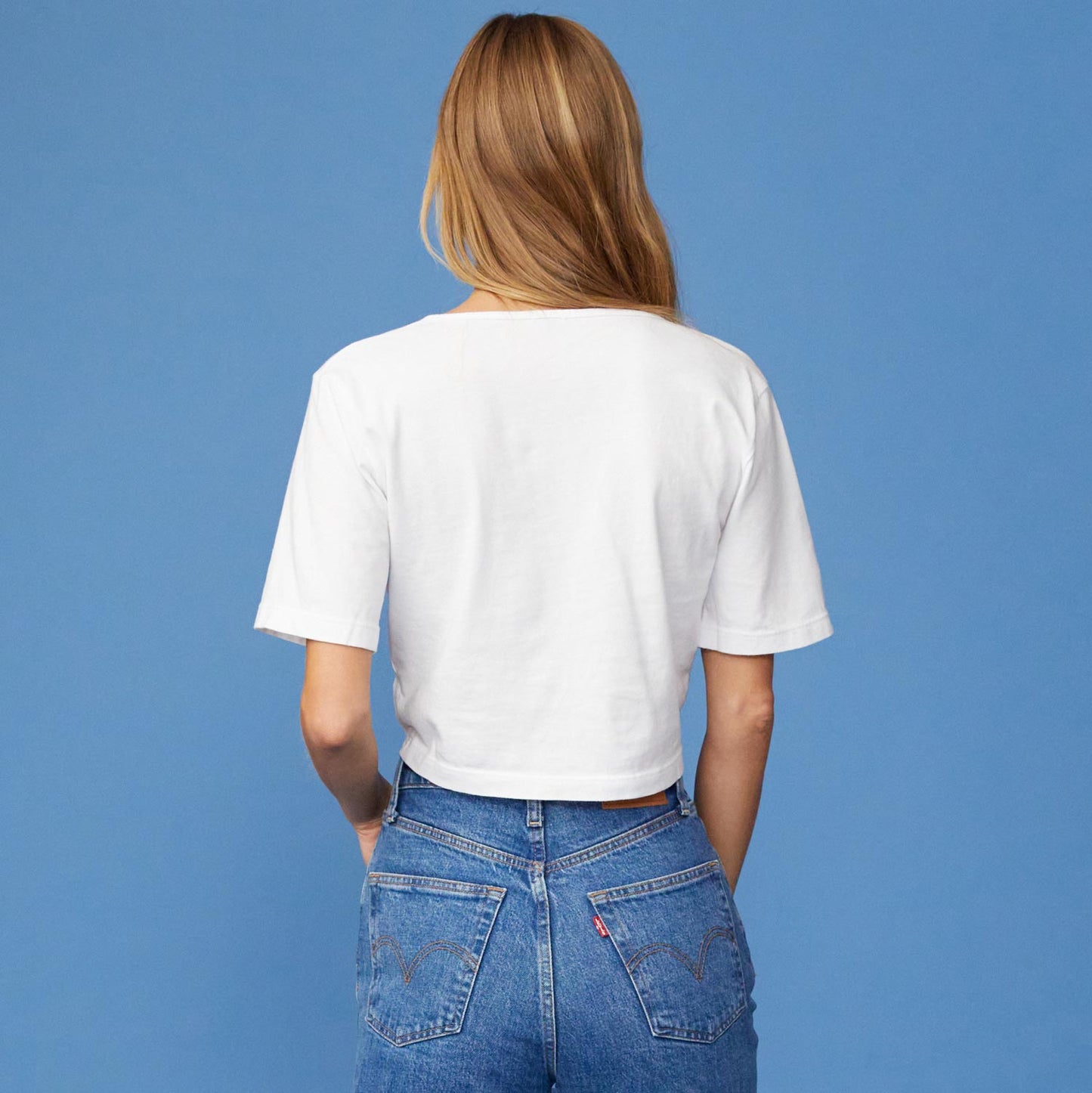 Back View of model wearing the Front Twist Top in White