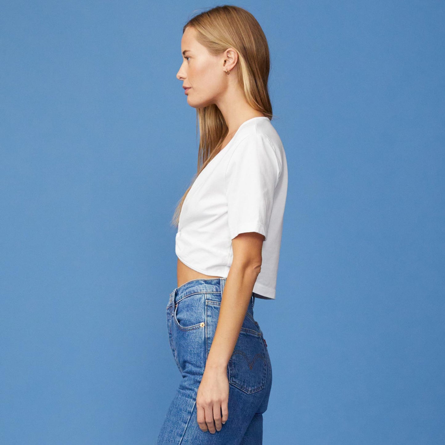 Side View of model wearing the Front Twist Top in White