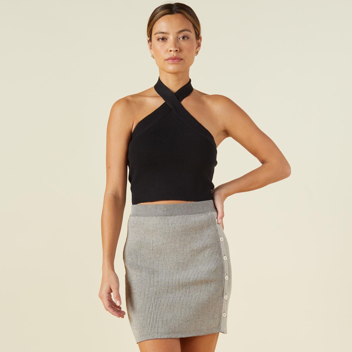 Front view of model wearing the supersoft sweater knit halter in black.