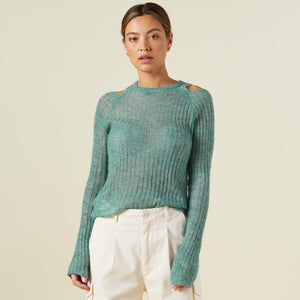 Front view of model wearing the mohair cut out sweater in kale green.