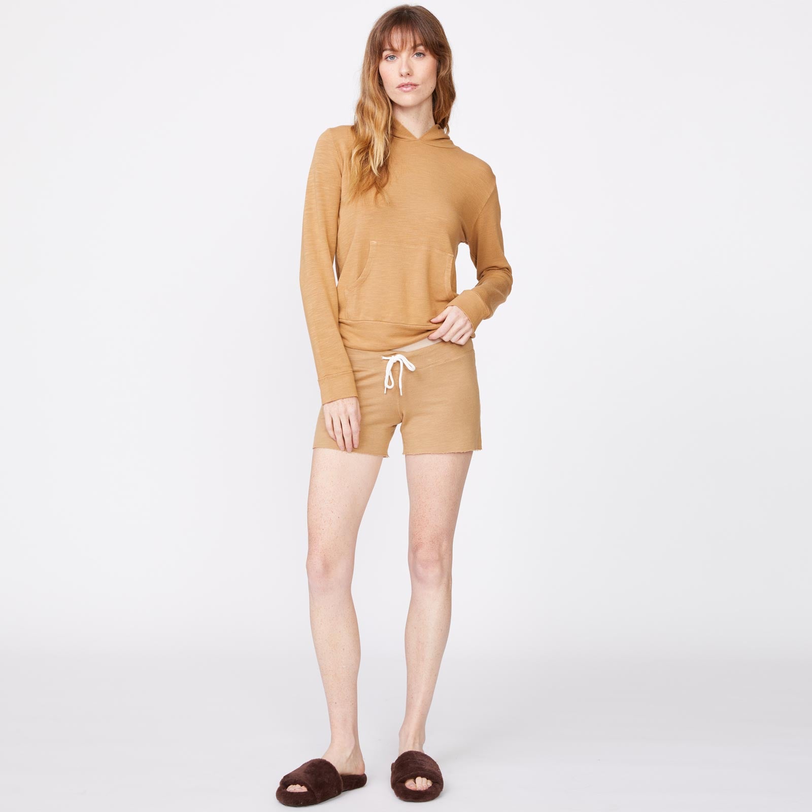 Front view of model wearing the supersoft pullover hoody in latte.