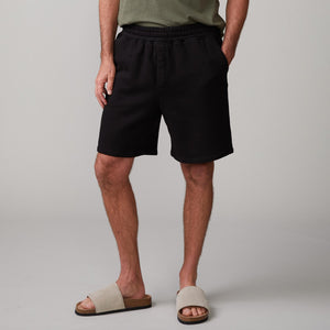 Front view of model wearing the 70's shorts in black.