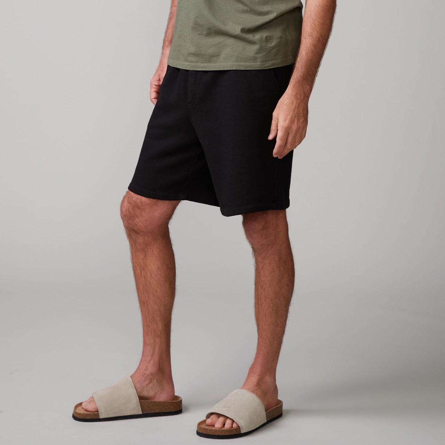Side view of model wearing the 70's shorts in black.