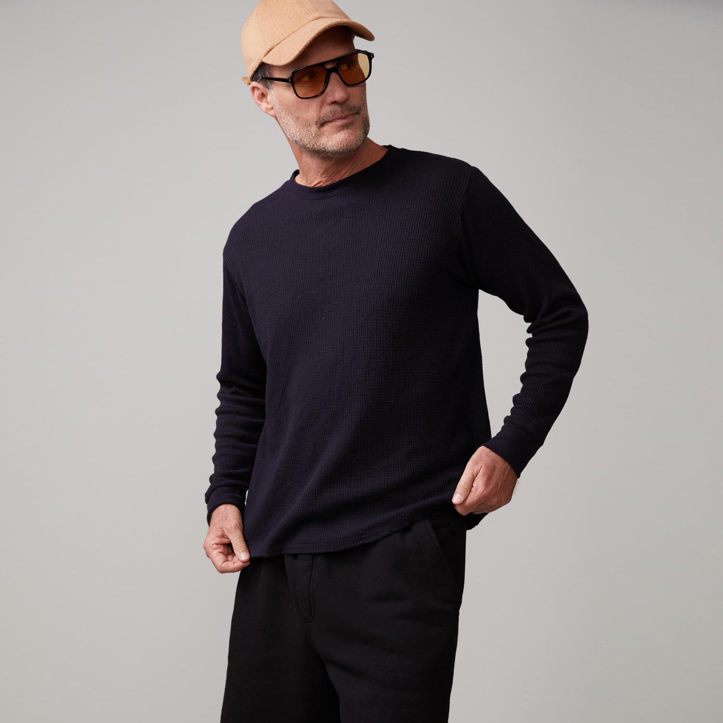 Front view of model wearing the thermal long sleeve crew in black.