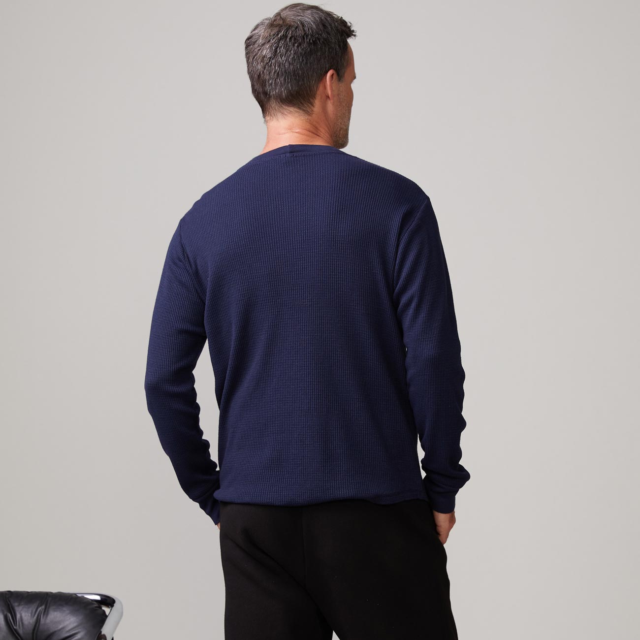 Back view of model wearing the thermal long sleeve crew in indigo.